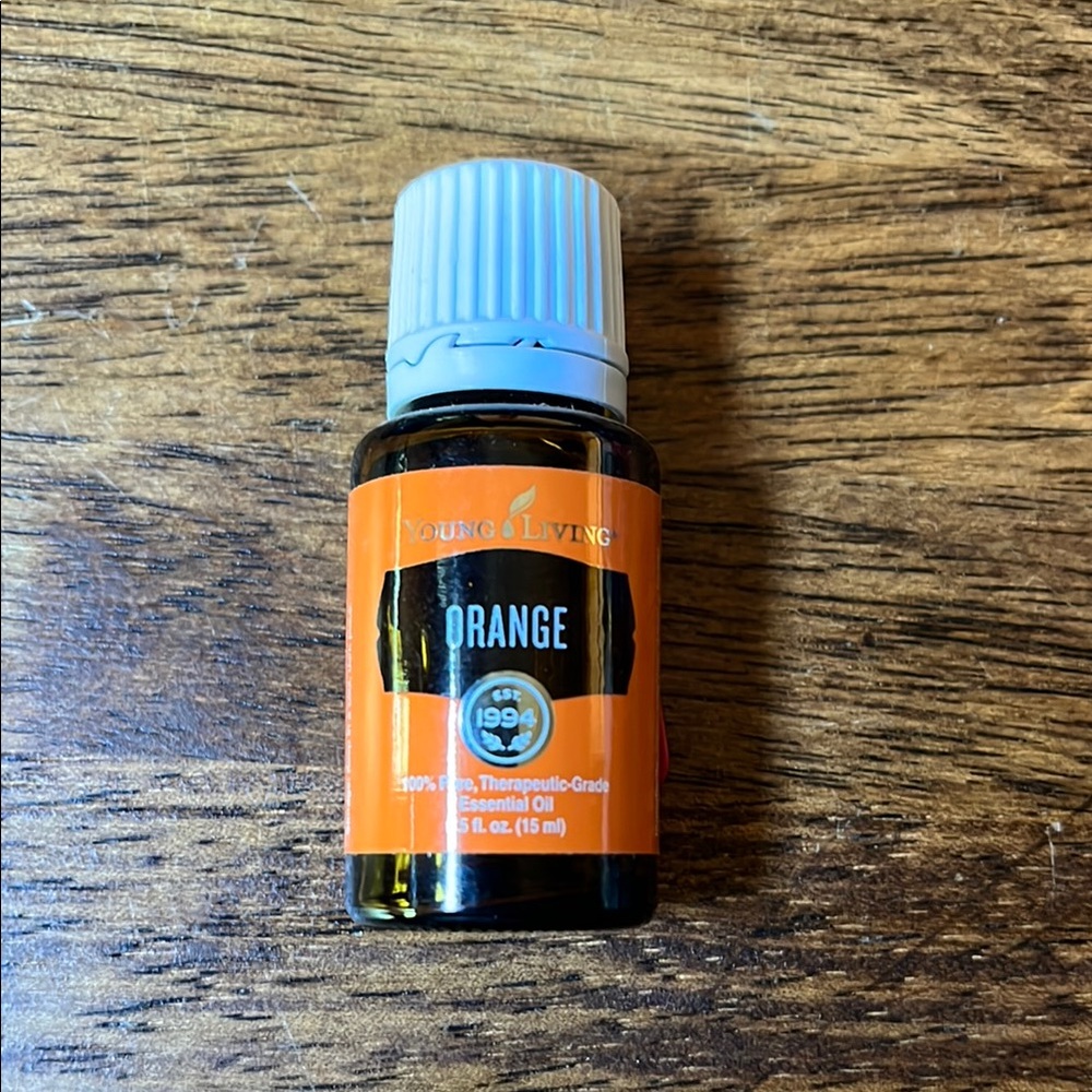 Young Living Orange Essential Oil with Black and White Accents